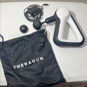 Theragun Black and White Massage Device
